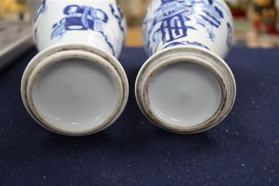 A pair of Chinese blue and white vases, wood stands